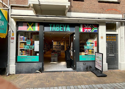 Storefront with 'TABEYA' branding and various flags displayed above the entrance.